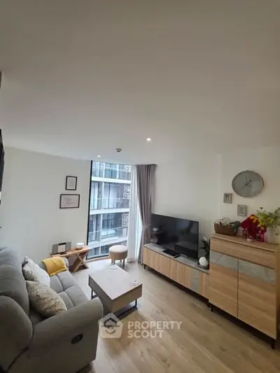 Modern living room with stylish decor and large window view