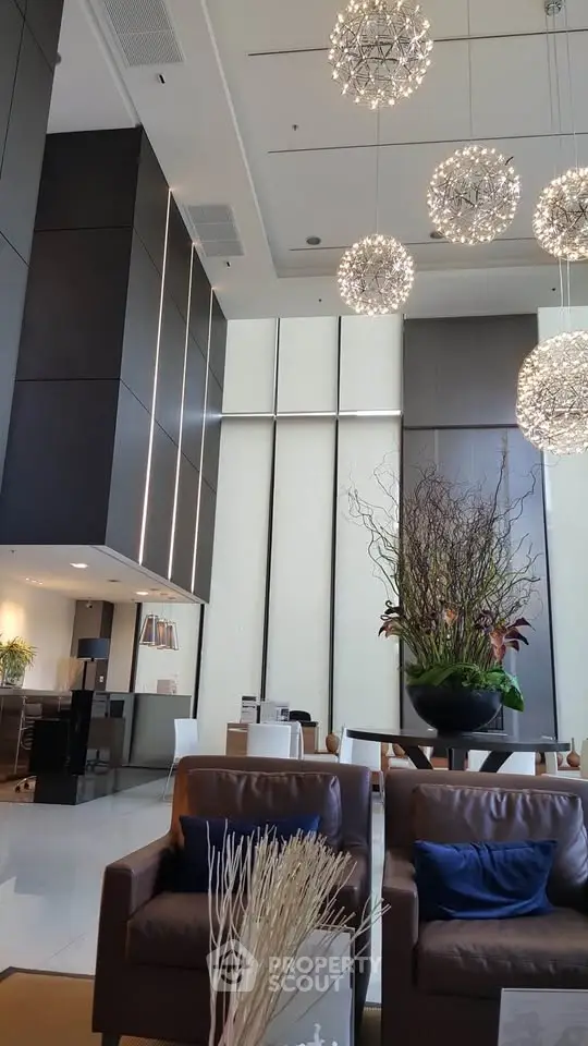 Luxurious modern lobby with high ceilings and elegant lighting fixtures