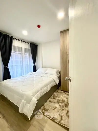 Cozy bedroom with modern decor and natural light