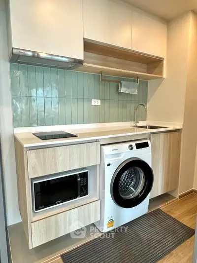 Modern kitchen with integrated appliances and sleek cabinetry