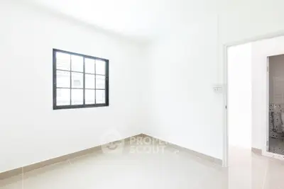 Bright and minimalistic empty room with tiled floor and window, perfect for customization.