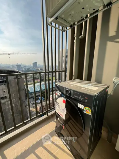 High-rise balcony with washing machine and city view, perfect for urban living.