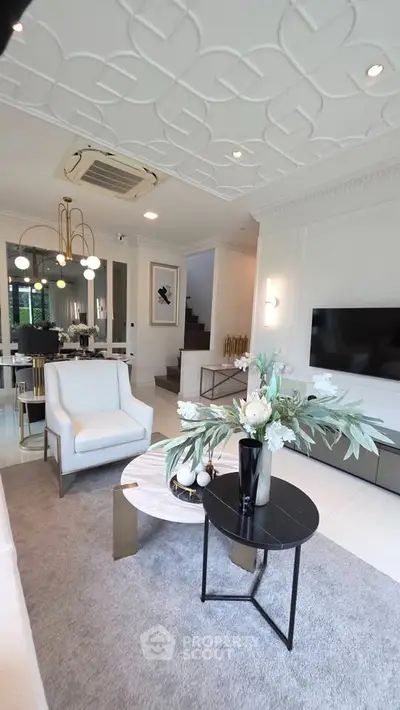Luxurious living room with elegant decor, modern furniture, and stylish lighting in a sophisticated home.