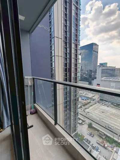 Modern high-rise balcony with cityscape view, perfect for urban living enthusiasts.