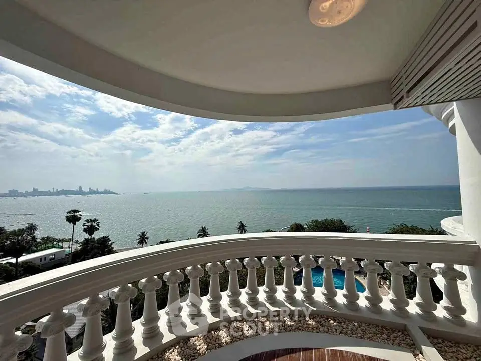 Stunning ocean view from a luxurious balcony with elegant balustrades, perfect for relaxation.