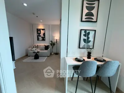Modern living room with stylish decor and dining area in open layout apartment