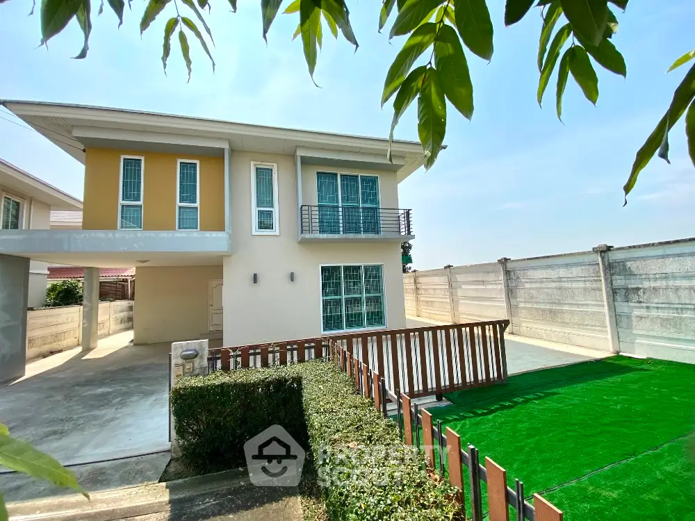 Modern two-story house with spacious driveway and green lawn