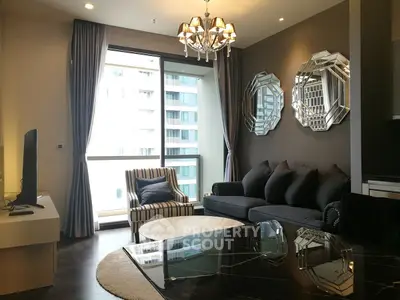 Luxurious modern living room with elegant decor and large windows offering city views.