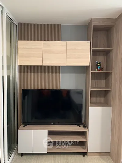 Modern living room with stylish TV cabinet and shelving unit