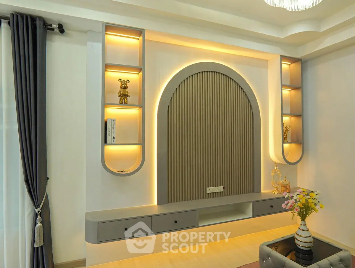 Elegant modern living room with stylish wall decor and ambient lighting