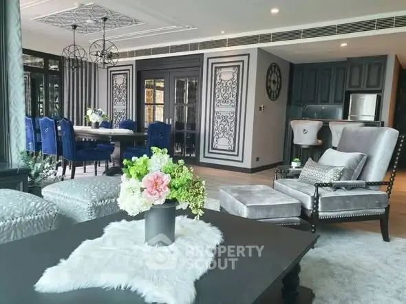 Luxurious living room with elegant decor and plush seating in a modern apartment.
