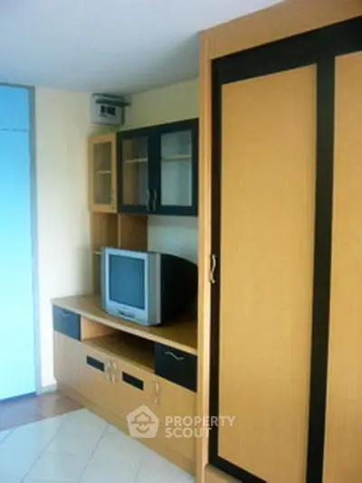 Compact living room with built-in storage and TV unit