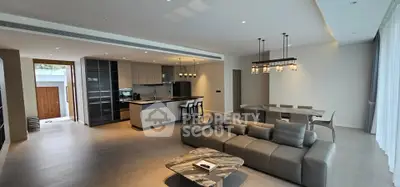 Luxurious open-plan living room with modern kitchen and elegant dining area