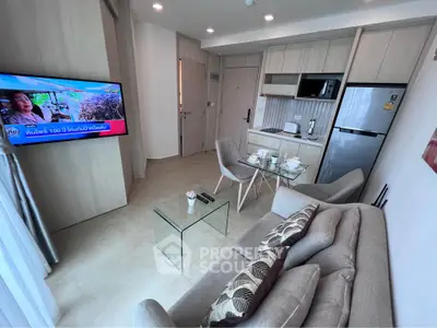 Modern living room with sleek furniture and open kitchen layout