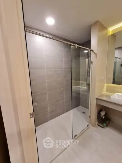 Modern bathroom with glass shower enclosure and sleek design