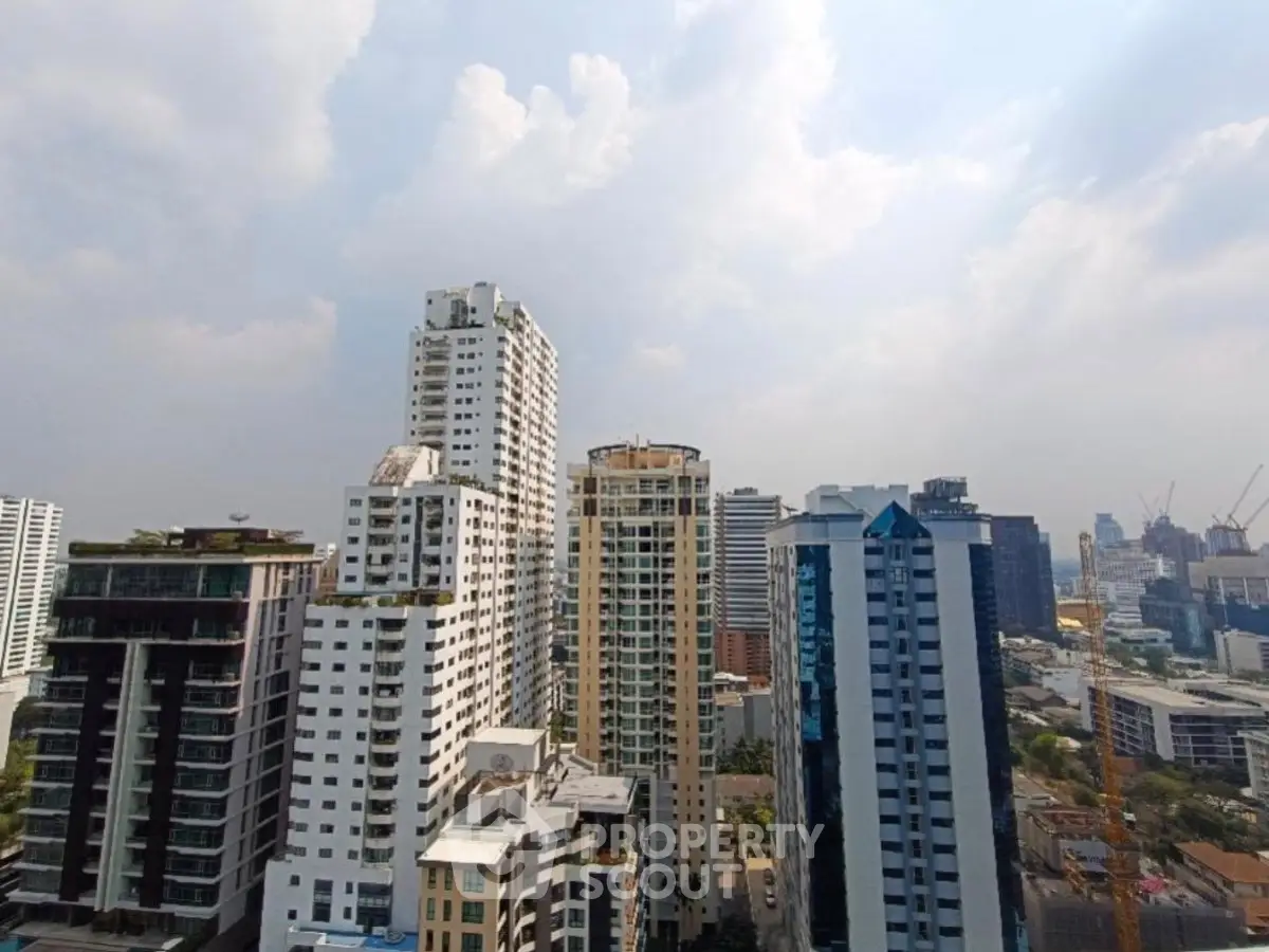 Stunning cityscape view of modern high-rise buildings under a clear sky, showcasing urban living at its finest.