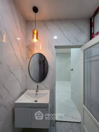 Modern bathroom with elegant vanity and stylish lighting
