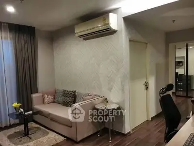 Stylish living room with modern decor and air conditioning, perfect for comfort and relaxation.