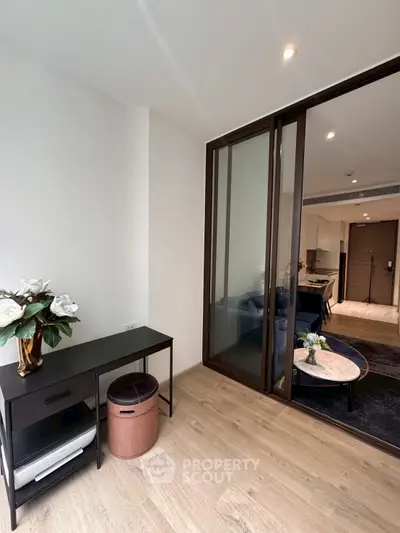 Modern living room with sliding glass doors and stylish decor