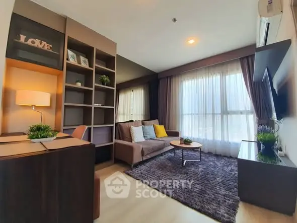 Modern living room with cozy sofa, stylish shelving, and large window for natural light.