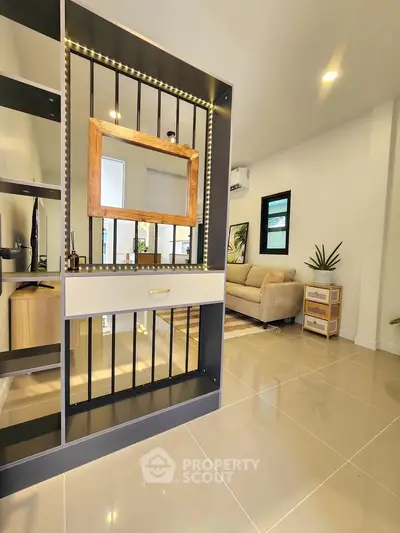 Modern living room with stylish partition and cozy seating area
