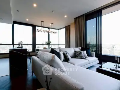 Luxurious modern living room with panoramic city views and elegant decor.