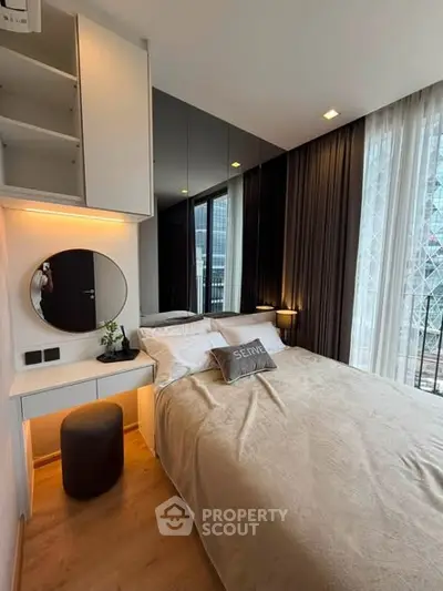 Modern bedroom with cozy decor, large window, and stylish furnishings in a high-rise apartment.