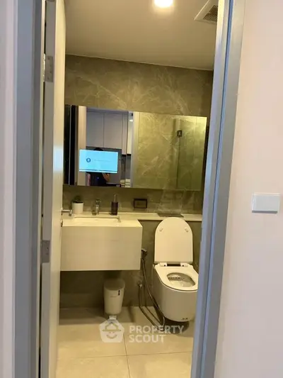 Modern bathroom with sleek design and elegant fixtures in a contemporary apartment.