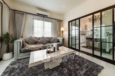 Luxurious living room with elegant decor and modern kitchen view