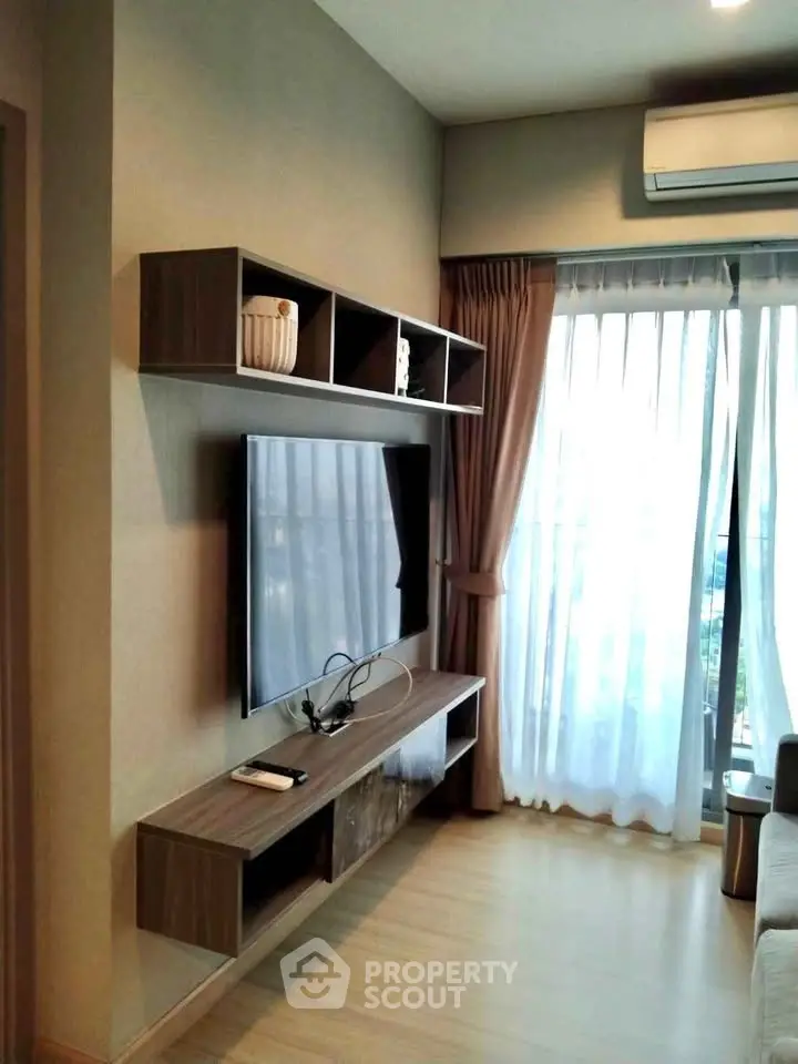 Modern living room with wall-mounted TV and stylish shelving