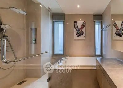 Luxurious modern bathroom with elegant fixtures and a spacious bathtub.