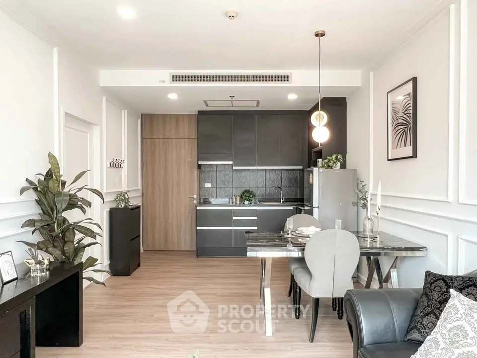 Modern open-layout kitchen and dining area with sleek design and stylish decor