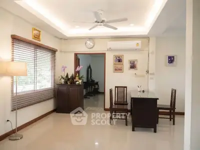 Spacious living room with modern decor and natural light