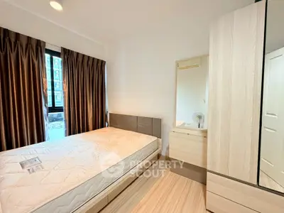 Modern bedroom with stylish decor and ample natural light