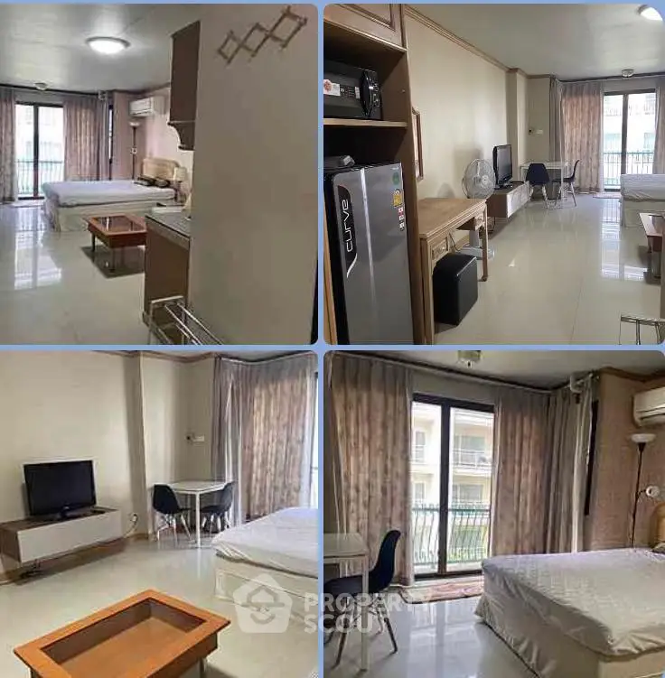 Spacious studio apartment with modern furnishings and large windows for natural light.