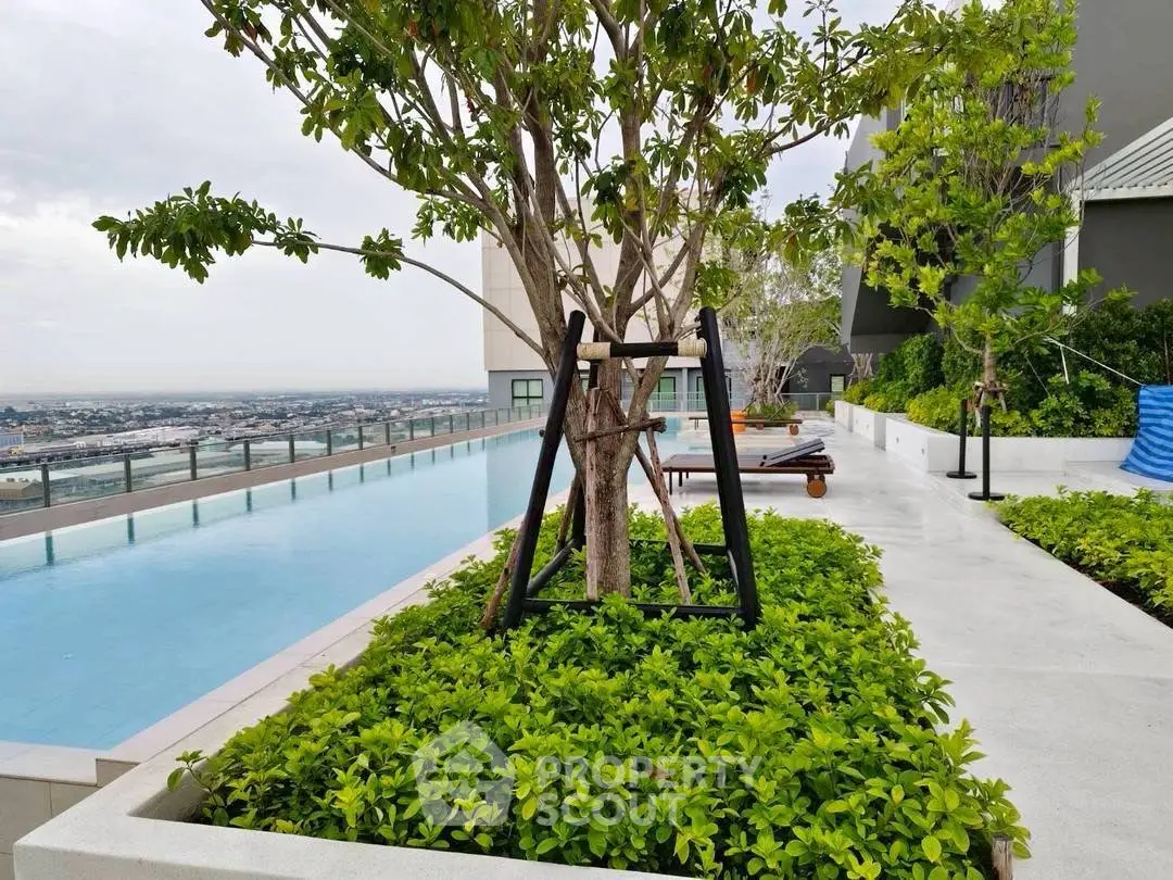 Luxurious rooftop pool with stunning city view and lush greenery