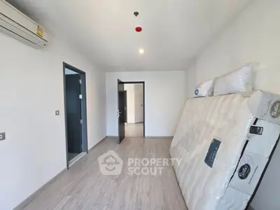Spacious unfurnished room with air conditioning and laminate flooring