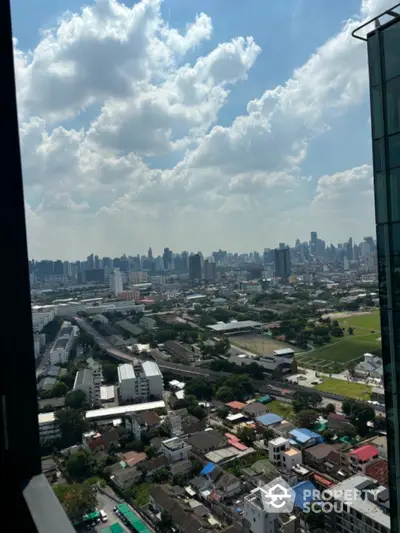 Stunning cityscape view from high-rise building with clear blue sky