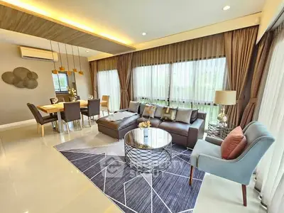 Luxurious modern living room with elegant decor and ample natural light