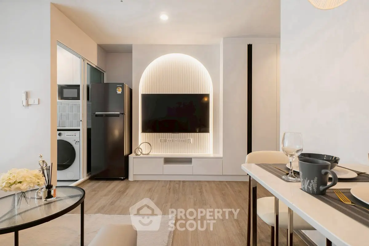 Modern living room with stylish decor, open layout, and built-in TV unit