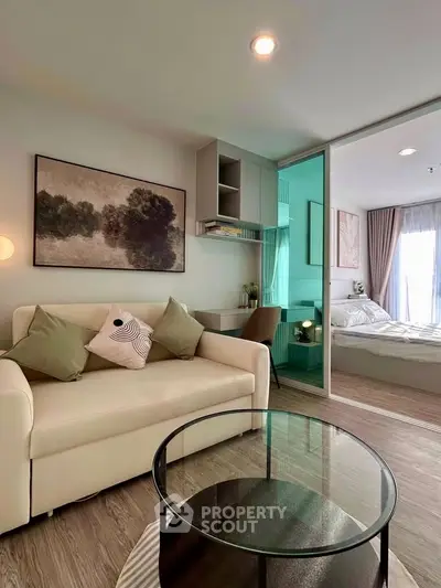 Modern living room with cozy sofa and stylish decor in a contemporary apartment.