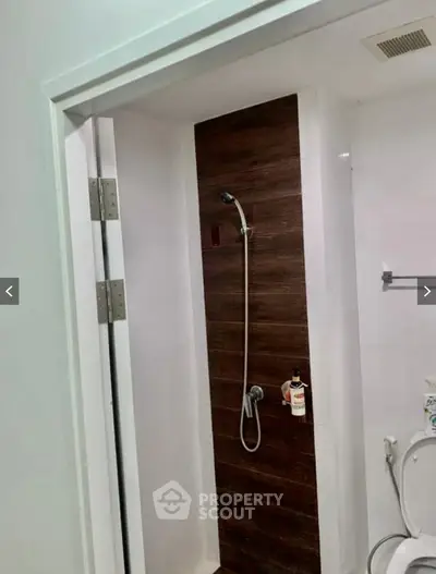 Modern bathroom with sleek shower design and contemporary fixtures.