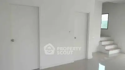 Minimalist interior with white walls and staircase, modern design