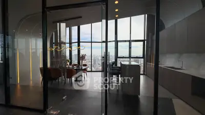 Luxurious open-plan kitchen and dining area with stunning city view