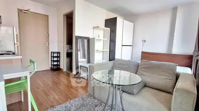 Modern studio apartment with cozy living area and stylish decor