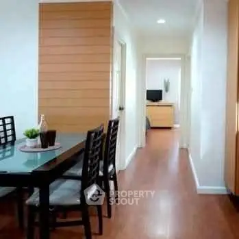 Modern dining area with sleek wooden flooring and stylish furniture