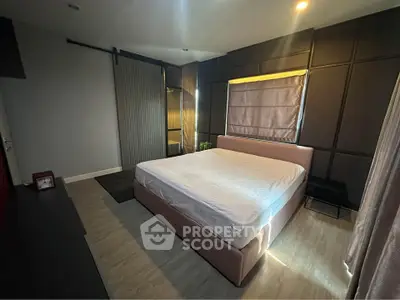 Modern bedroom with stylish decor and natural light