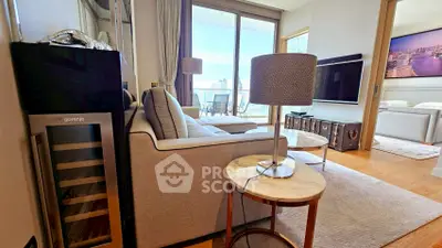 Spacious living room with modern decor and balcony view