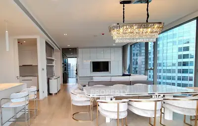 Luxurious modern living room with elegant chandelier and city view