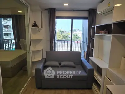 Modern living room with balcony view and stylish furniture in urban apartment